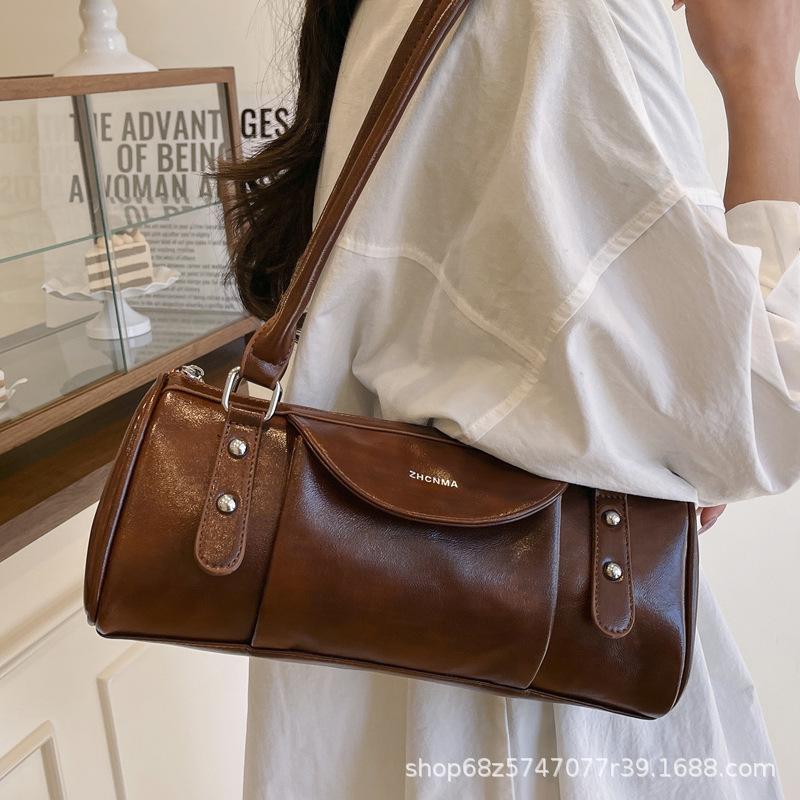 Retro high-end hand-held bowling bag women's 2025 new simple and fashionable shoulder bag versatile commuter messenger bag