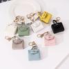 Cross-border Solid Color Small Square Bag Creative Gift Mouth Red Envelope Keychain Earphone Bag Car Pu Key Chain Pendant Wholesale