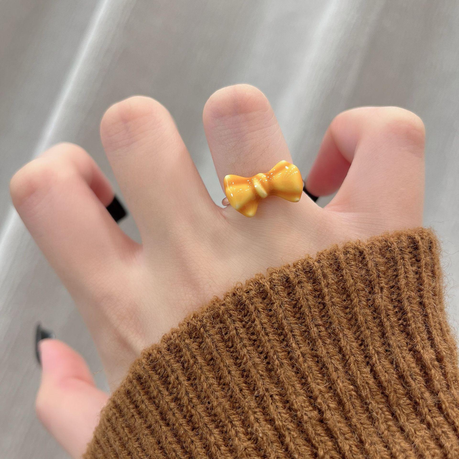 

Набор колец для вечеринки в виде кота с карамельным хлебом и рисунком «Осень/Зима» — креативный мультяшный дизайн Bow Bread Ring