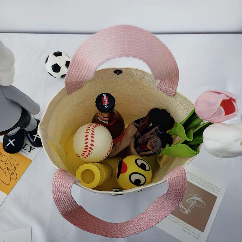 Damenhandtasche aus Canvas mit Nischendesign und Aufdruck, zum Mitnehmen von Lunchboxen, Bento-Stoffbeutel, einfache, vielseitige Einkaufstasche im literarischen Eimer-Stil