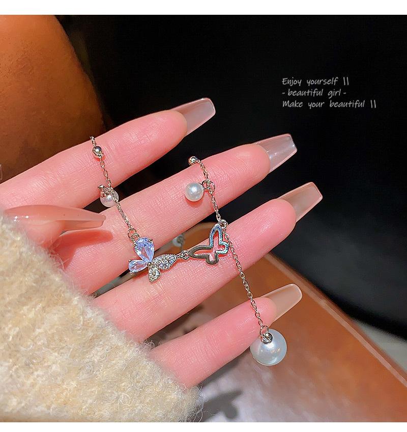 Premium temperament niche butterfly pearl titanium steel necklace women s new super fairy fringed collarbone chain