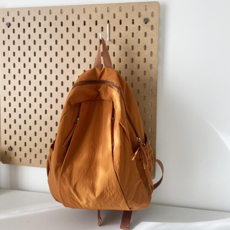 Travel lightweight advanced sense niche backpack college student commuter junior high school girls schoolbag Japanese and Korean simple backpack