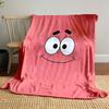 A simple pink background with a smiling cartoon face and wide eyes. for all seasons blanket lunch break throw gift