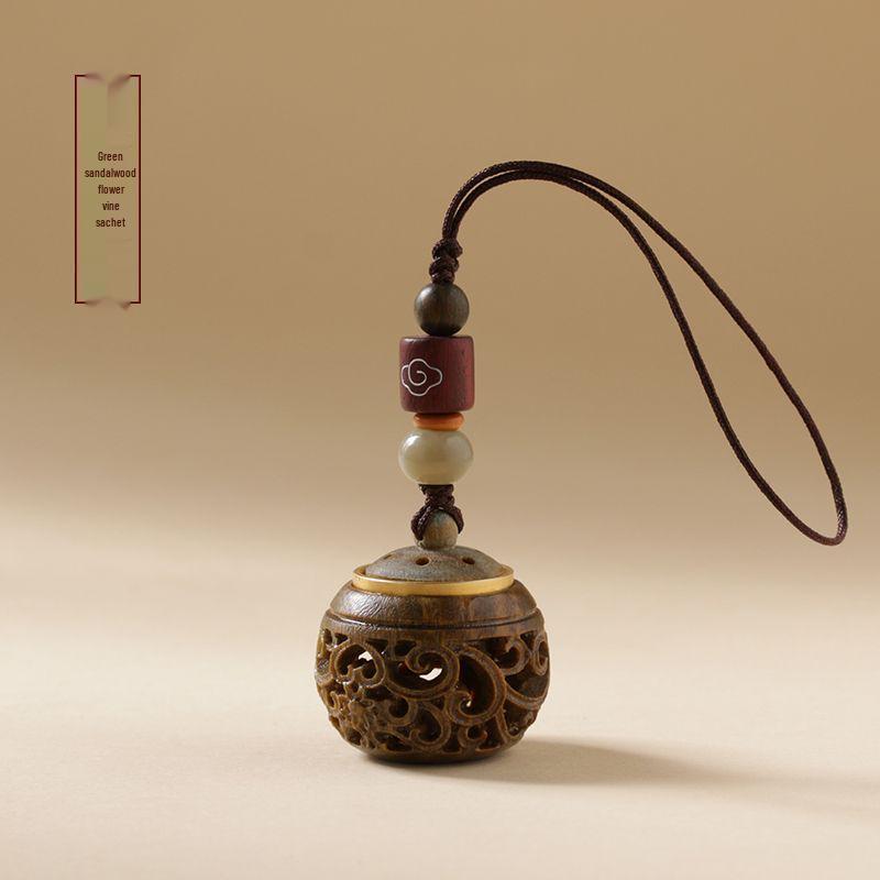 Green Sandalwood Hollow Mobile Phone Chain: Exquisite Aromatherapy Sachet Ball and Tibetan Incense Pendant Keychain in Ancient Style.