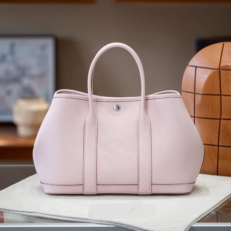 

2025 Новая женская сумка из натуральной кожи с верхним слоем из коровьей кожи и узором из коровьих сухожилий 2330 Садовая сумка ручная одноплечевая через плечо 30x13x21cm розовый