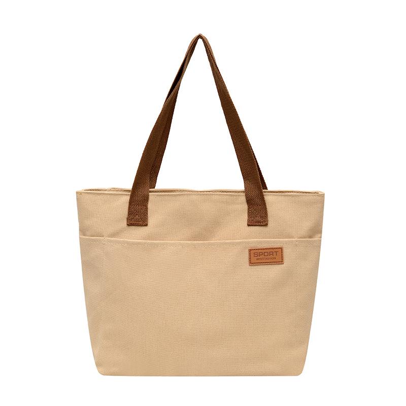 Women's Versatile Canvas Tote - Lightweight, Large Capacity, Single Shoulder or Handheld Bag for Students and Commuters.