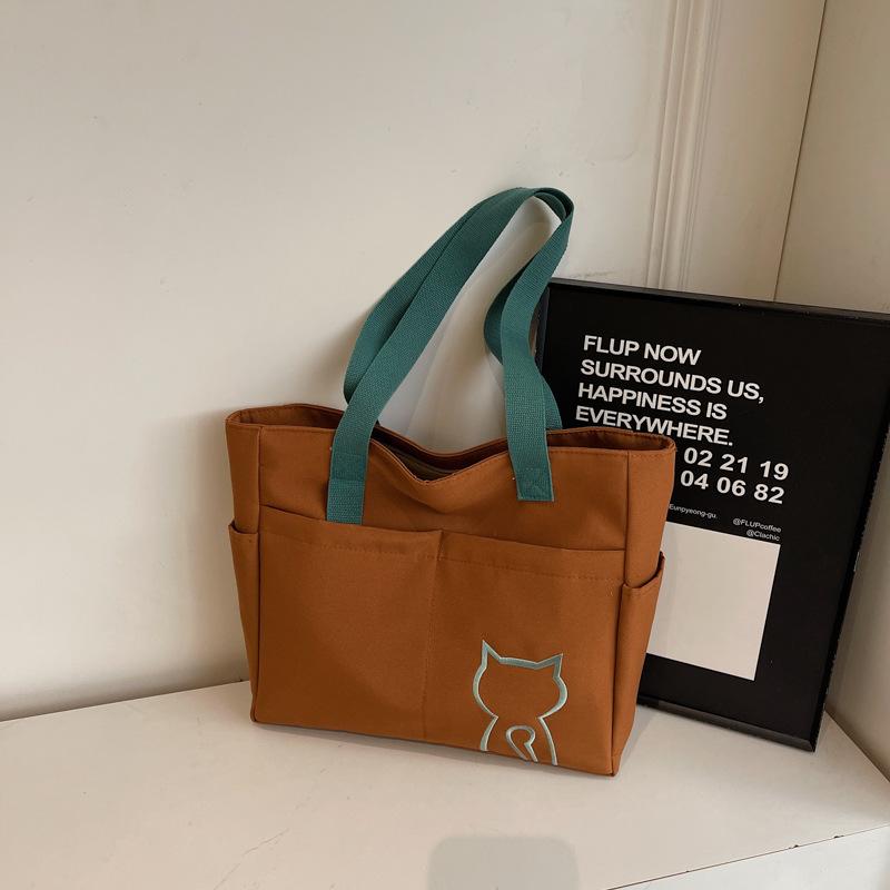 2025 new niche design women's bag on the street portable tote bag cute student messenger bag fashion shoulder bag women