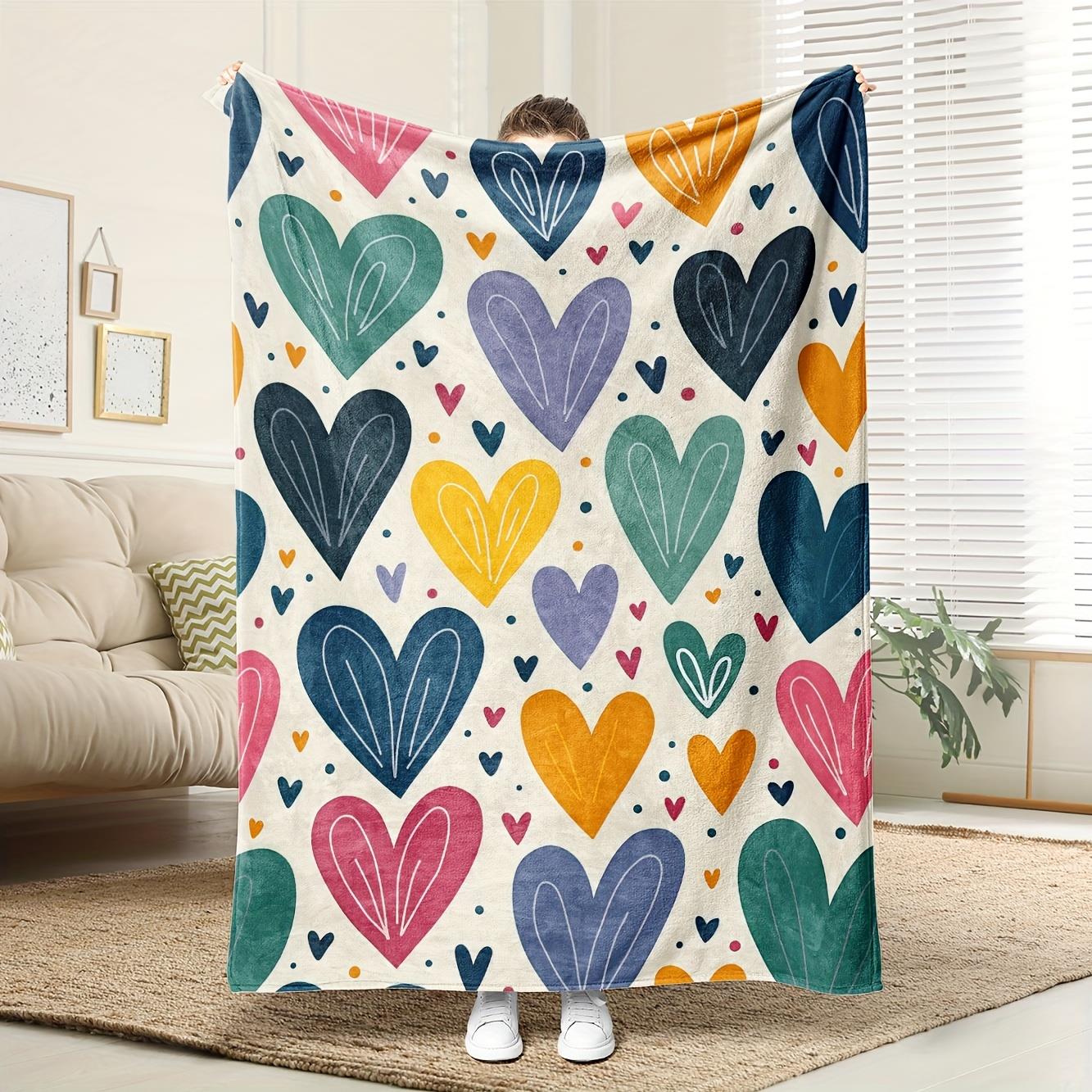 

This colorful heartprint blanket made of polyester is machine washable and ideal for home décor and comfort 75x100cm