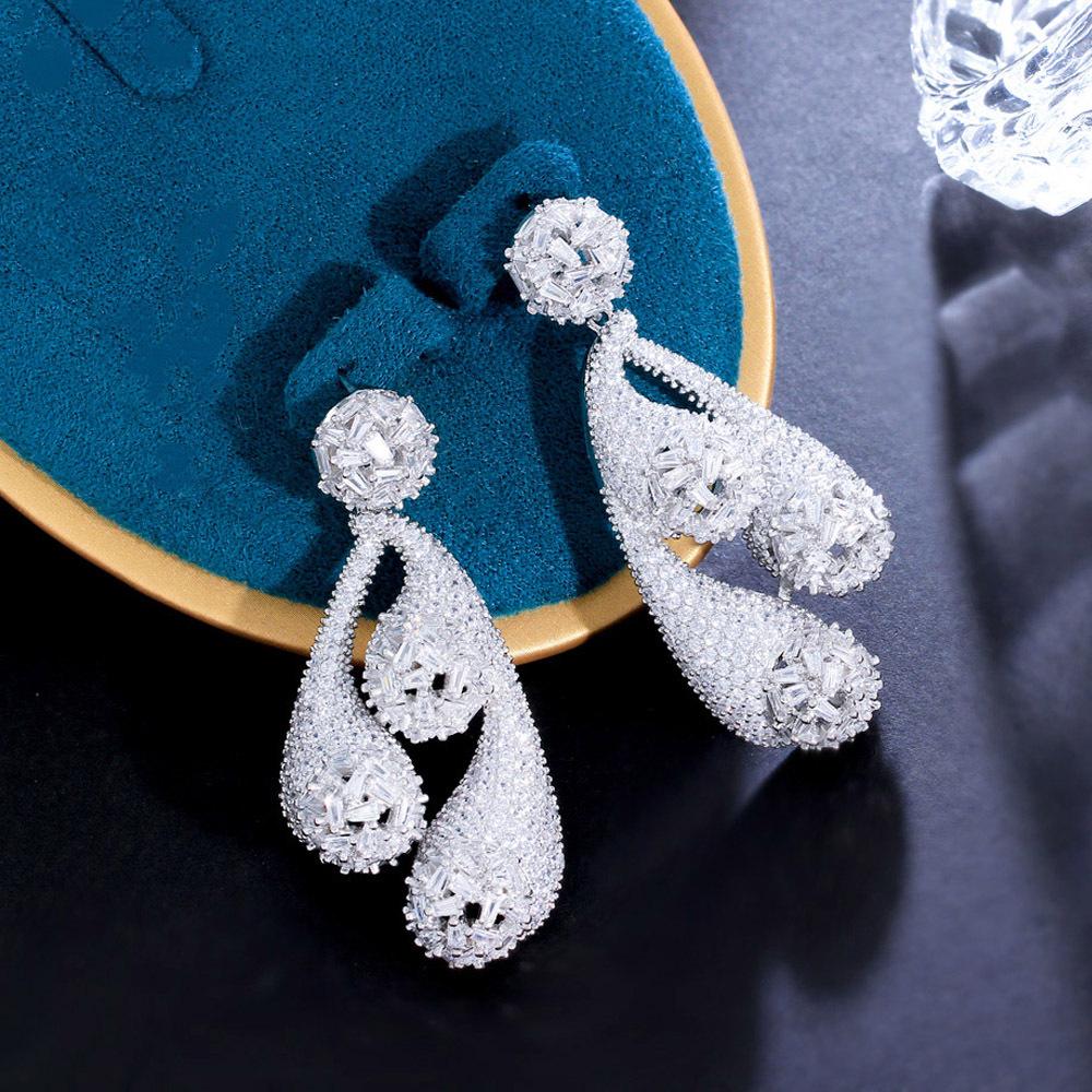 

Французская Тяжелая Промышленность Полные Бриллиантовые Серьги Супер Вспышка Микро Циркон Полые Благородные Серьги белого золота