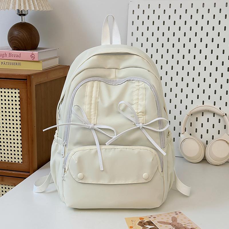 New pleated drawstring bow design sense schoolbag female junior high school college student travel backpack