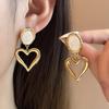 European & American Titanium Heart Cat's Eye Earrings - Hollow Exaggerated Design, Versatile and Exquisite Women's Jewelry