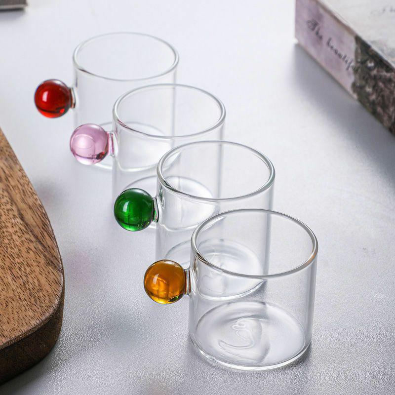 

Multicolor Round-Handle Glass Cup: Heat-Resistant, Compact Design for Coffee, Tea, and Water 50ml синій