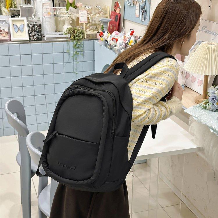 Schoolbag junior high school girls lightweight and simple spine protection to reduce the burden of versatile large-capacity schoolbag out of high