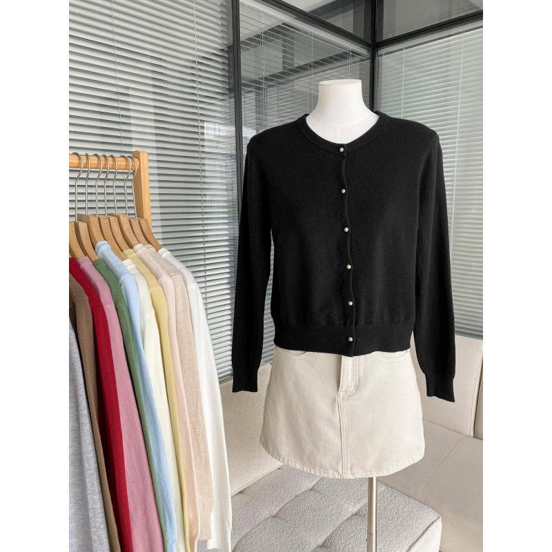 Korean simple round neck singlebreasted candycolored knitted cardigan women's new early autumn gentle wind longsleeved jacket