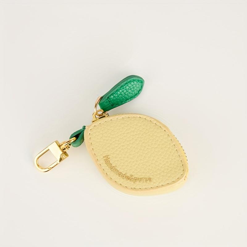 

Милый кошелек-монетница с шармом в виде лимона - Компактный кошелек-брелок на молнии, синтетическая искусственная кожа золотистого тона и бирка в виде зеленого листа жёлтый