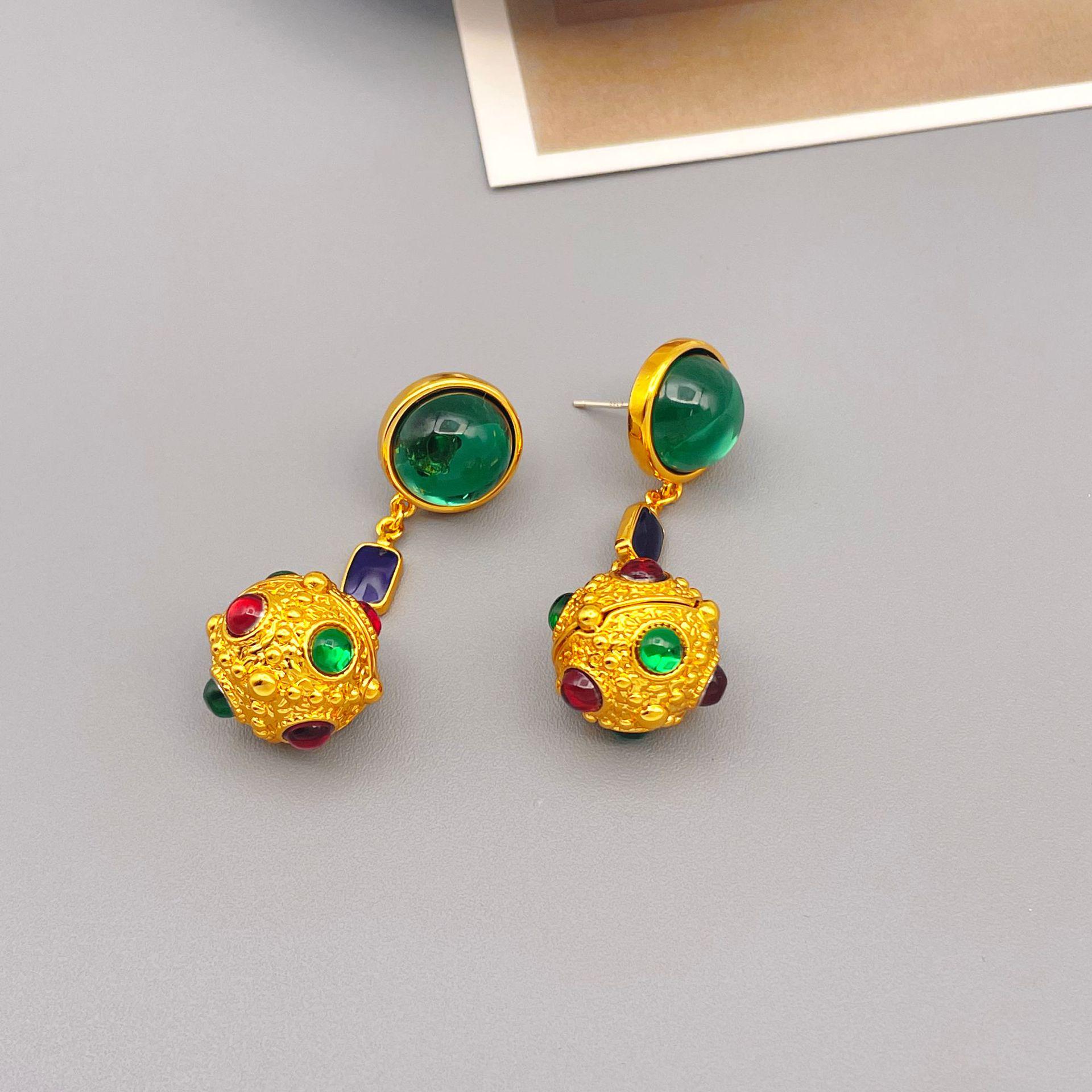 

Винтажные серьги-подвески в виде золотых шариков из смолы с серебряной иглой 925 пробы