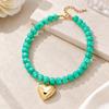 Adjustable Beaded Pendant Necklace with Rounded Resin Beads, Heart-Shaped Center Pendant, Extension Chain, and Lobster Clasp