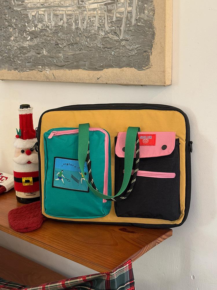 

Korean niche color matching computer bag women s 2025 new portable shoulder handbag casual large-capacity tablet bag