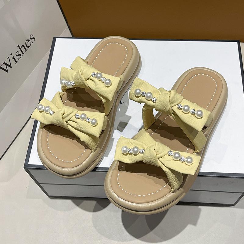 thick-soled pearl slippers for women to wear in the summer of 2025, the new fairy style fashion bow muffin open-toed sandals