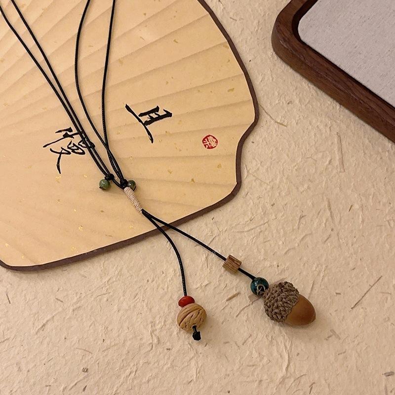 New Chinese ceramic acorn pendant woven rope necklace women's retro ethnic long collarbone chain niche design neck chain