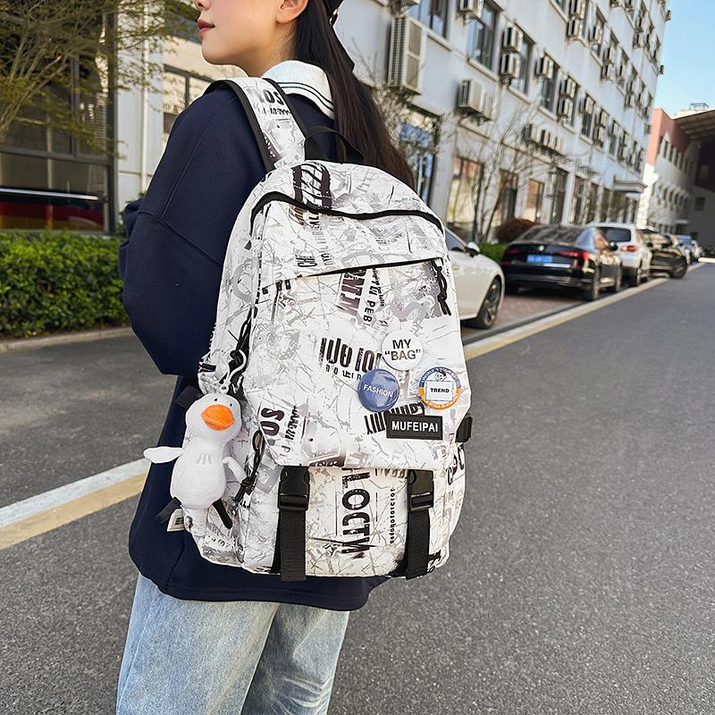 Backpack women's new fashion Japanese personality graffiti junior high school student schoolbag male college student lightweight travel backpack tide