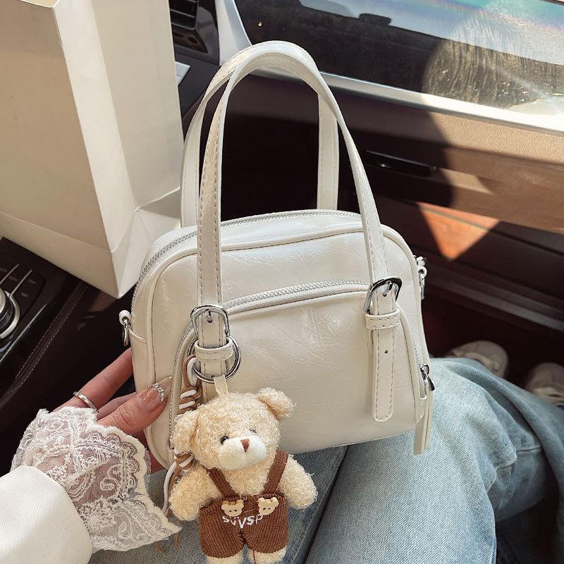 Spring and Summer New Korean Niche Ins Wind Oil Wax Leather Portable Pillow Bag Casual Versatile Commuter Wind Messenger Women's Bag