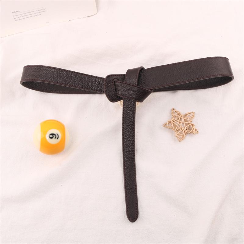 Lychee Pattern Knotted Cowhide Belt: Versatile, Fashionable Waist-Cincher for Women's Coats, Windbreakers, and Dresses.