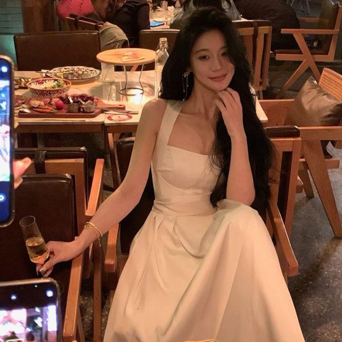 French temperament white dress women s summer new cross-strap high-end niche suspender waist slim dress M белый