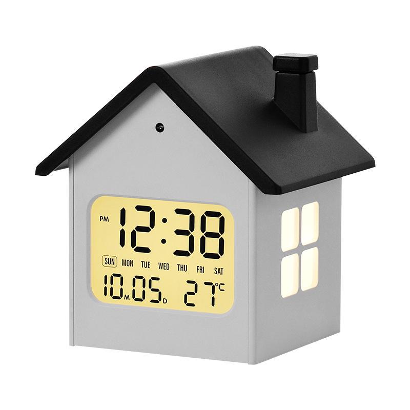 Hausförmiger Multifunktionaler Kinderwecker mit Nachtlicht und LCD-Anzeige.