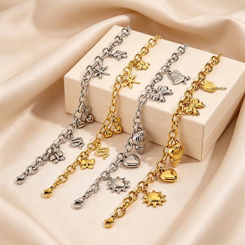 Women's European Retro Multi-Element Titanium Steel Bracelet with 18K Gold Plating and Pearl Accents