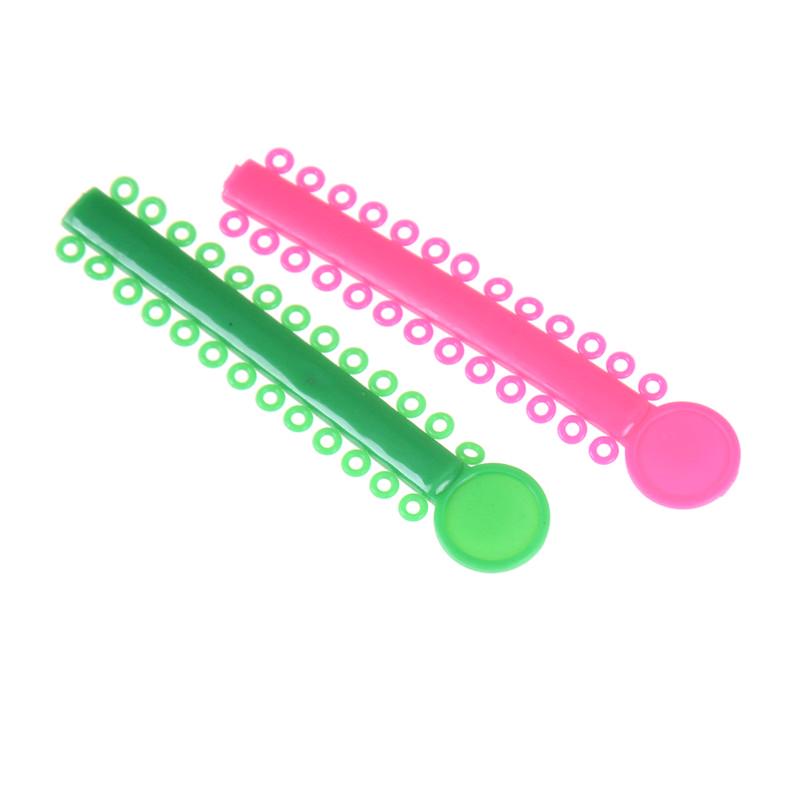 Bague de ligature en caoutchouc avec attaches élastiques pour traitement orthodontique