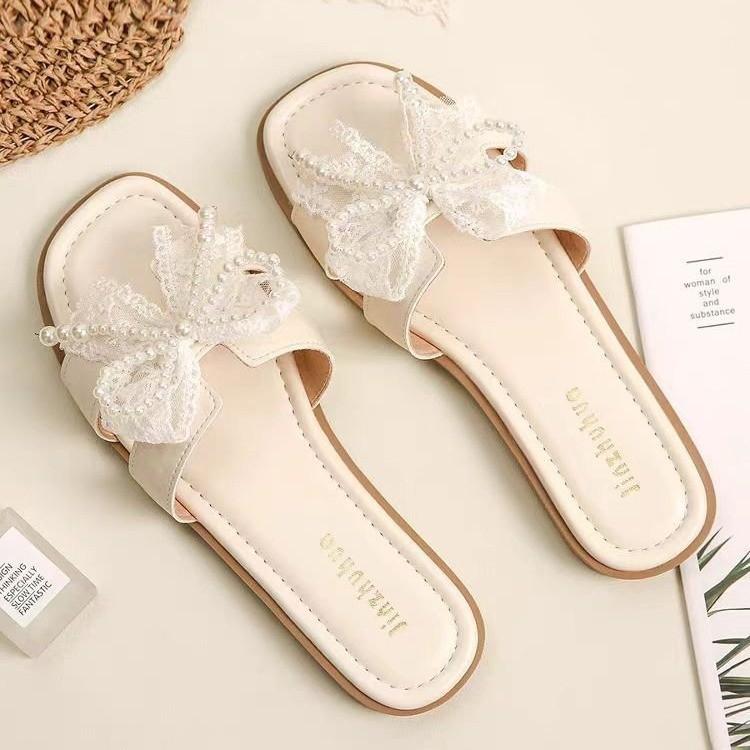 Fairy wind bow pearl slippers female 2025 summer new Korean version of Internet celebrity flat bottom square head cool slippers