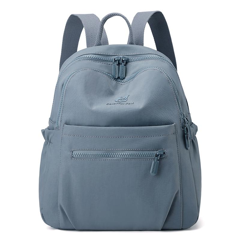 Compact Nylon Casual Backpack with Front Zipper Pocket and Side Pockets for Women Everyday Use синий