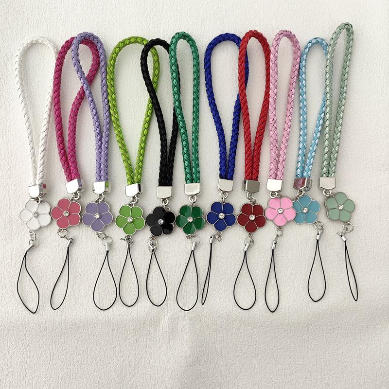 Camellia Four-Leaf Clover PU Leather Phone Wrist Lanyard with Nylon Woven Cord and Phone Case Pendant