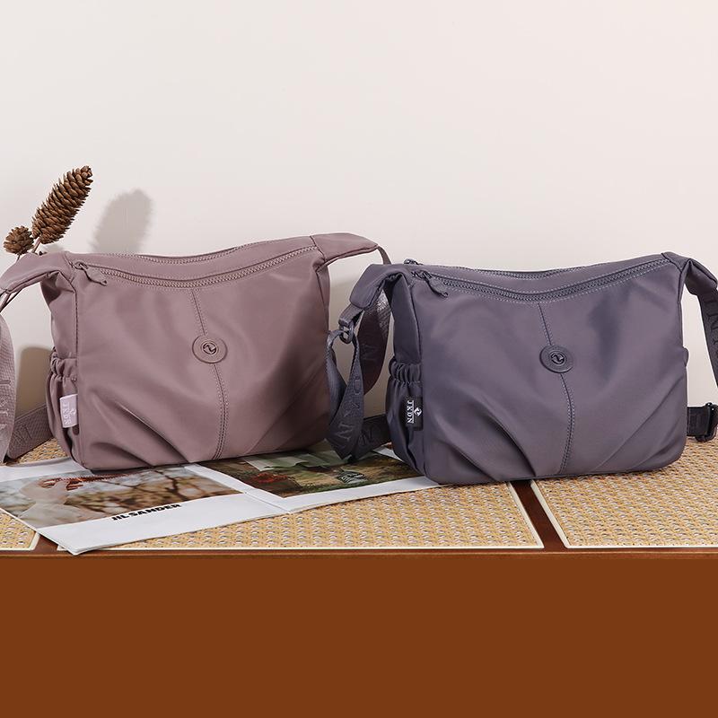Elegant Slouch Shoulder Bag with Top Zip Closure Adjustable Strap Geometric Stitching and Smooth Nylon Fabric for Modern Daily Wear and Commuting