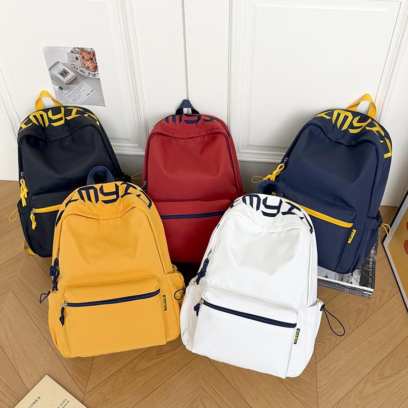 Schoolbag Japanese simple and versatile large-capacity solid color campus schoolbag 1011 summer new light commuter student backpack