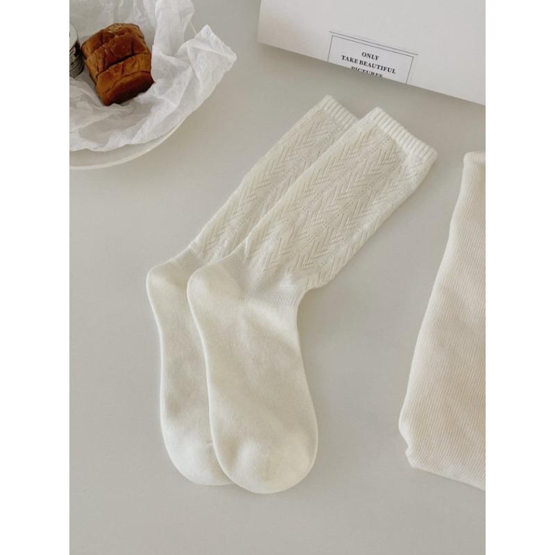 This Spring and Autumn Collection Features Solid-color Hollowed-out Mesh Pile Socks, Mid-calf Socks That Slimmer Legs, and Retro Style Socks