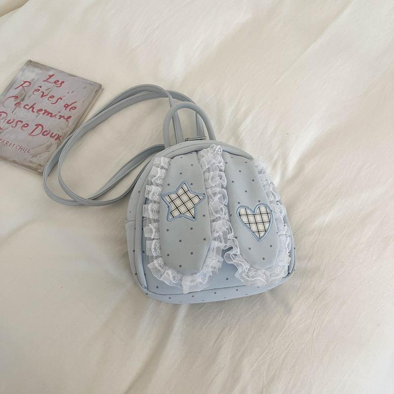 Schoolbag handsome rice family Korean simple foreign style polka dot love rabbit ear backpack 1011 spring new commuter student backpack