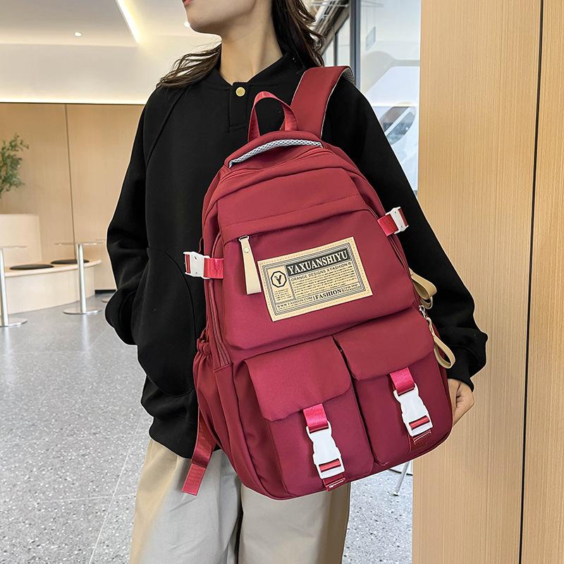 Fashionable casual large capacity multi-pocket labeling contrast color school bag for men and women students 23 autumn and winter new backpack