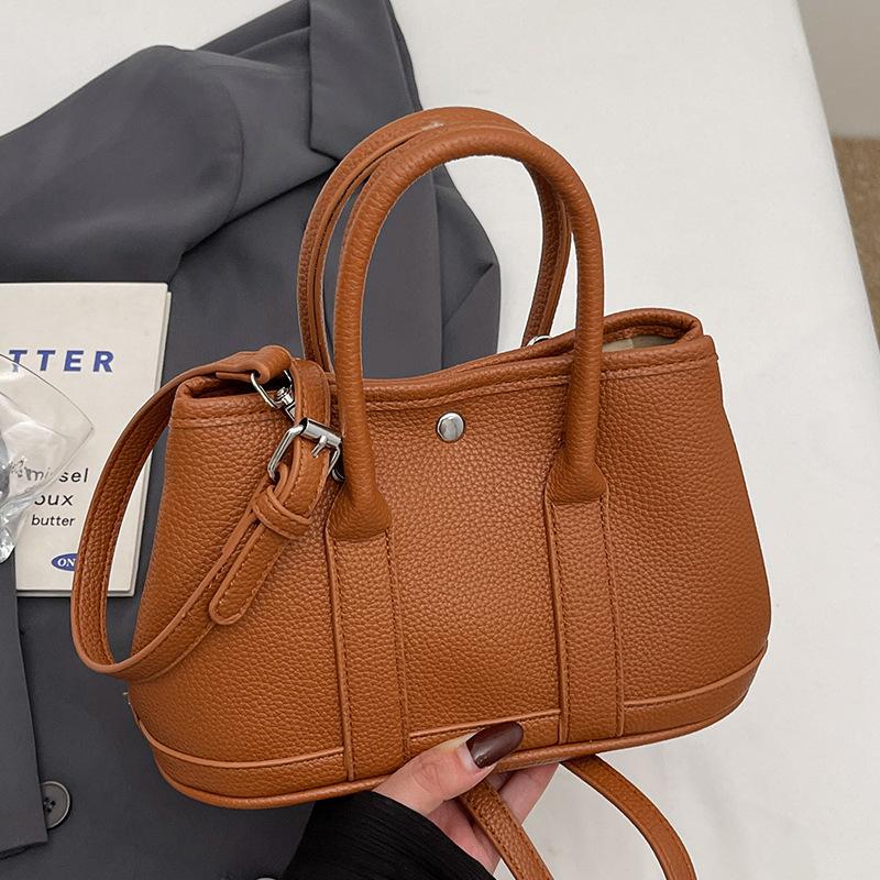 New Niche Simple Leisure Commuter Portable Bucket Bag Versatile Design Sense Solid Color Messenger Bag Women