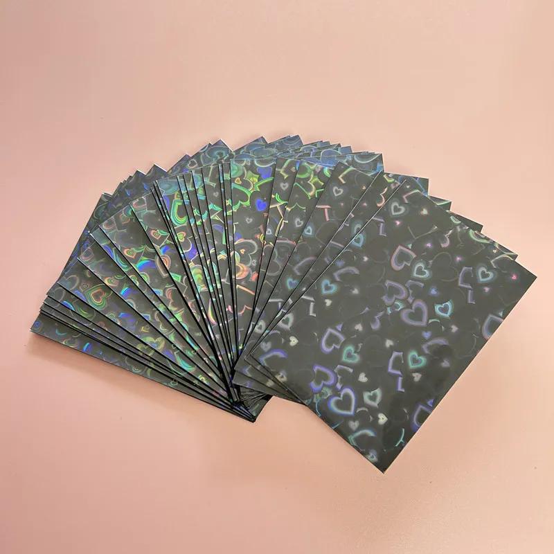 50pcs/lot 61*91mm Heart Love Laser Flashing Card Sleeves Protector For Photo Cards Holder Holographic Foil Protective Films
