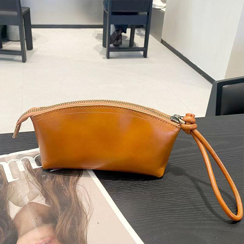 Handheld wallet New leather casual dinner bag First layer cowhide cosmetic bag Fashion versatile women's bag