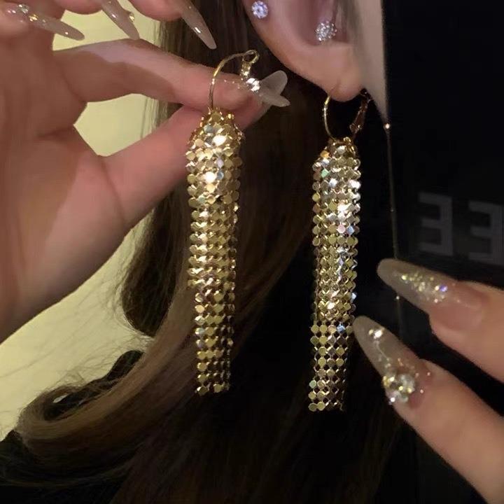 Silver Needle Sequin Tassel Earrings: Chic Cold Style, High-End Design, Fashionable Dangle for a Sophisticated Look.