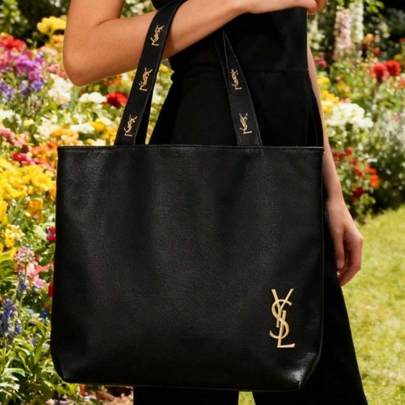 Schwarze Canvas-Umhängetasche von YSL, mit einem ultra-minimalistischen Design und großem Fassungsvermögen, geeignet für Arbeit, Shopping, Schule und Reisen.