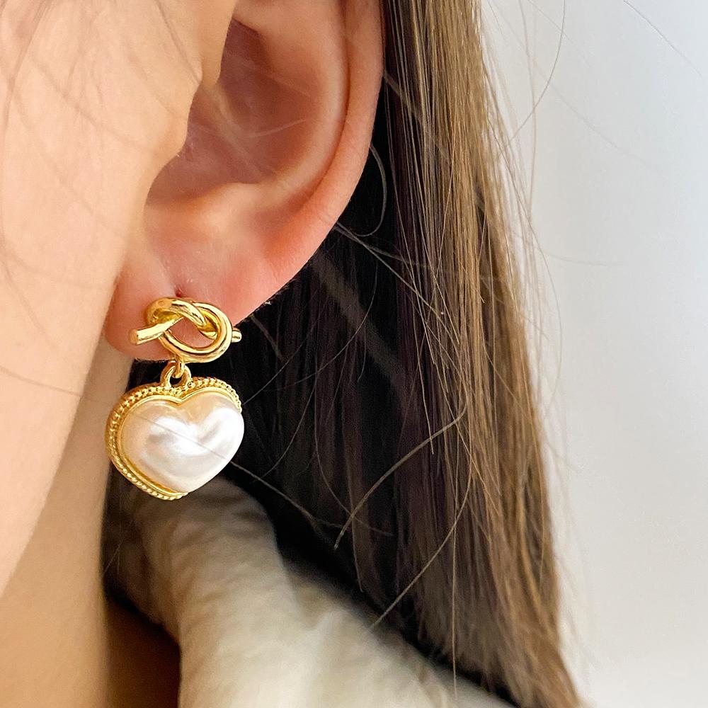 Boucles d'oreilles élégantes de couleur or pour femmes, tempérament blanc, boucles d'oreilles irrégulières, bijoux tendance, cadeaux