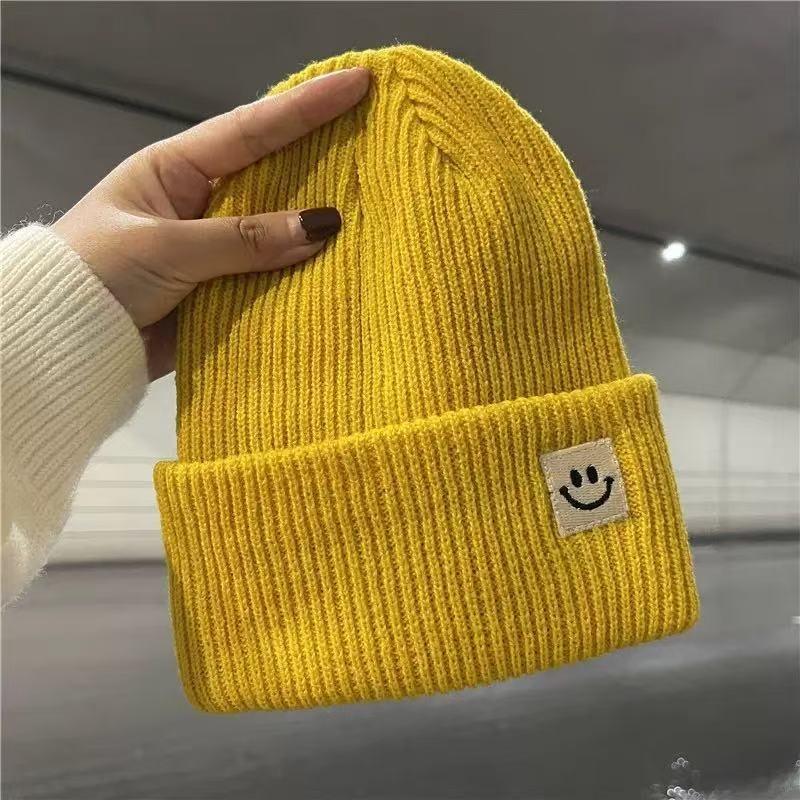 Devil smiley face label wool hat women's autumn and winter warm trend versatile ear protector black knitted hat