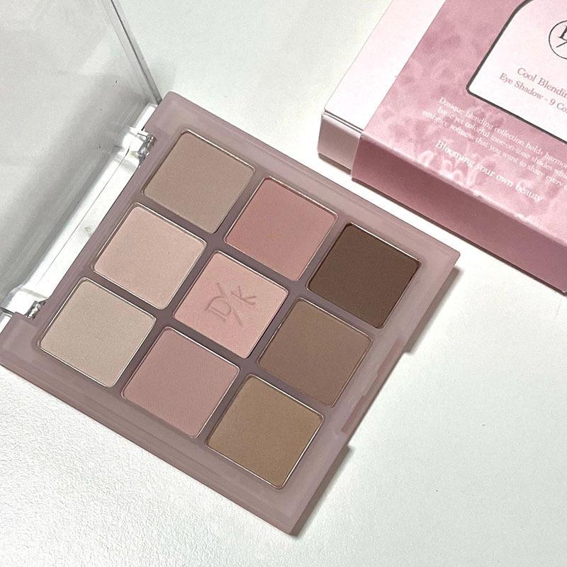 DIKALU Nine-Color Milk Tea Eyeshadow Palette: Acrylic Nude Series with Shimmer & Matte Finish.