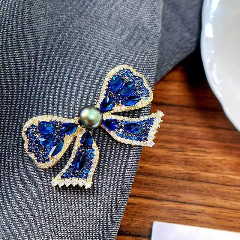 Exquisite Blue Bow Brooch: Gold-Plated Copper with Micro-Inlaid Zircon and Pearl