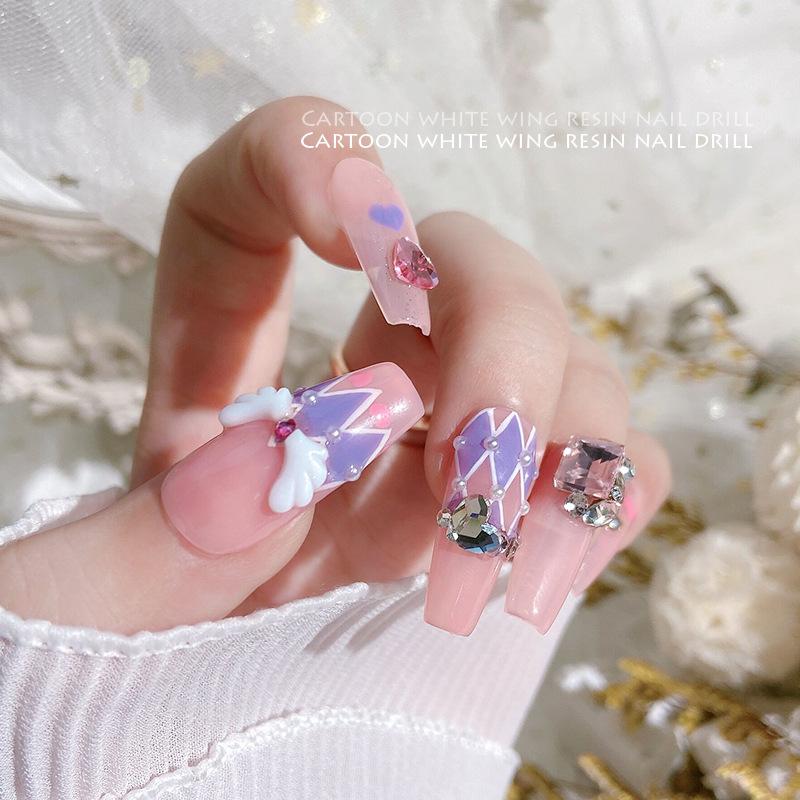 50 Stück links/rechts gespleißte Engelsflügel Nail Art Charms linke und rechte Flügel weißes Harz Nail Art Dekorationswerkzeuge