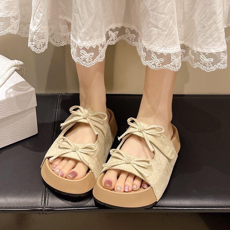 Thick-bottomed bow-tied cool slippers for women's summer wear, new versatile, comfortable and cute soft-bottomed one-word drag